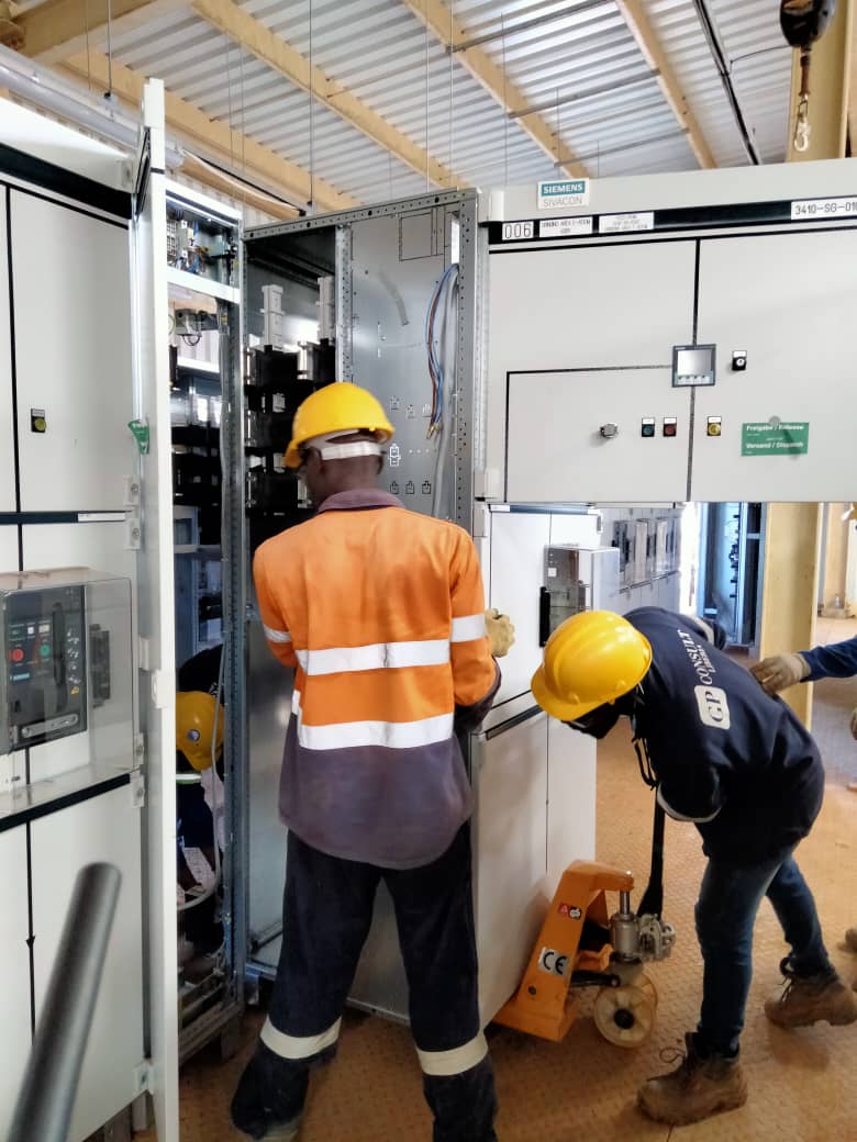 Technicians installing Siemens switchgear
